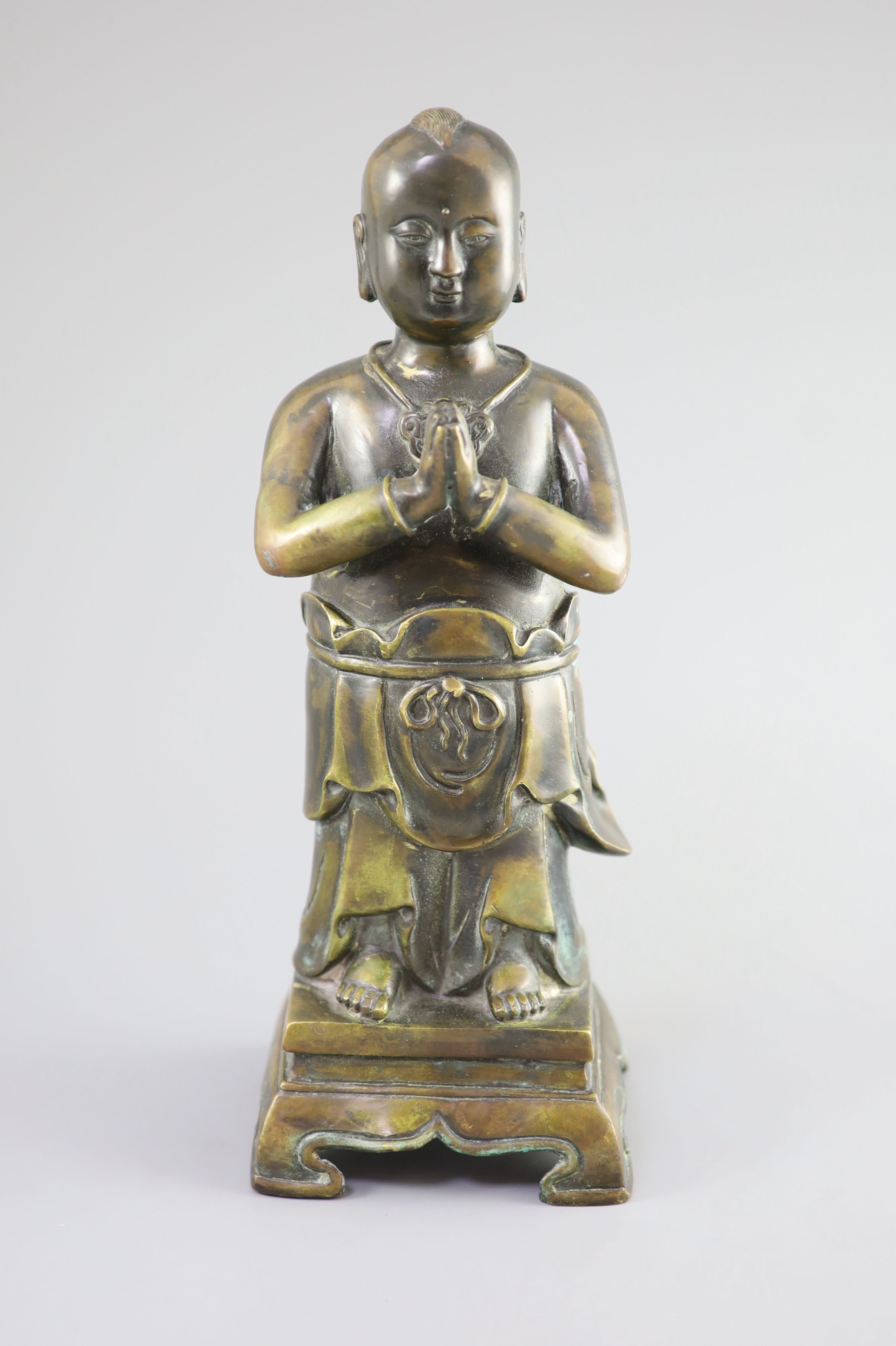 A Chinese bronze standing figure of Shancai Tongzi, 34cm high